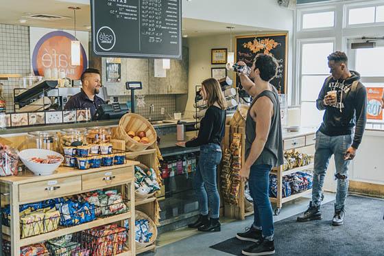 Photo of Chatham University students lining up for coffee and food in Cafe Rachel